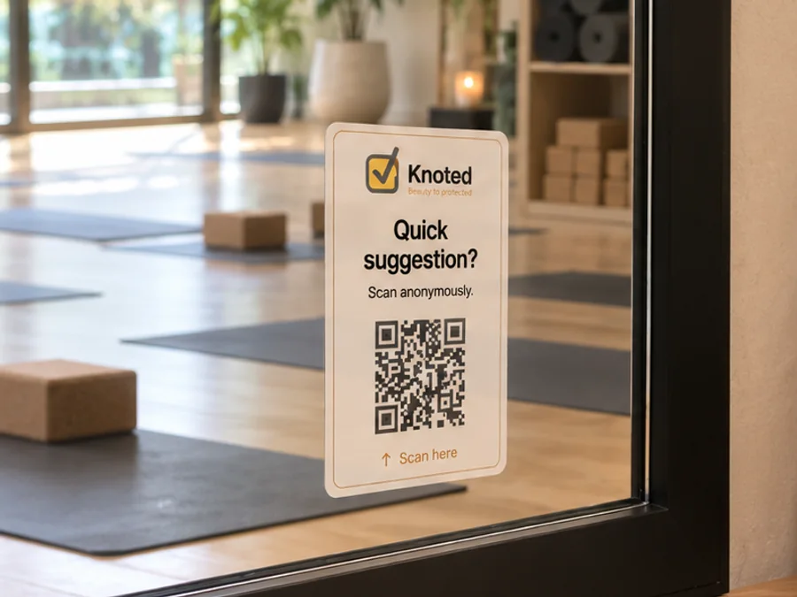 Knoted QR sign on a pilates studio mirror